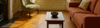Elegant herringbone parquet flooring in a restored Dublin townhouse living room.