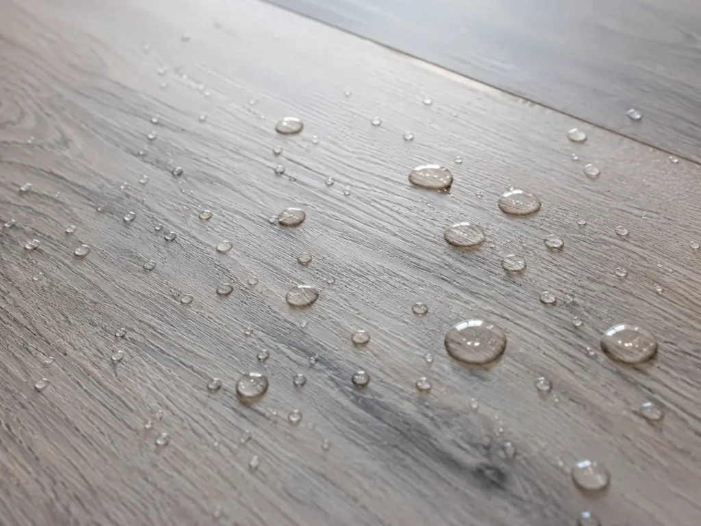 Water beading on waterproof LVT, ideal child-friendly flooring for damp Irish homes
